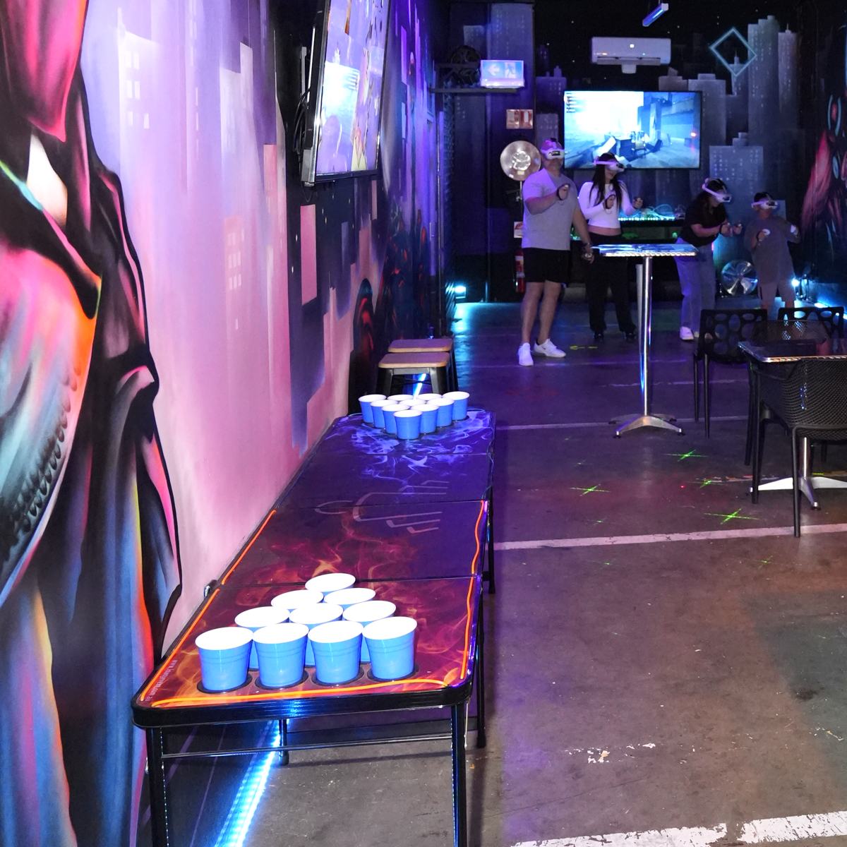 Glowing beer pong tables, racked and ready